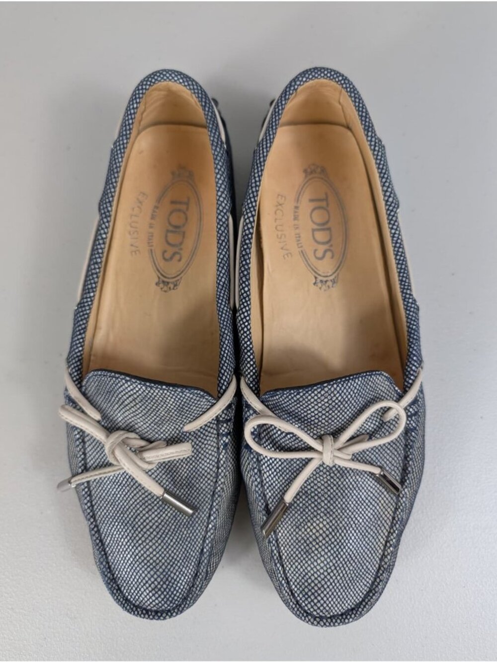 Tod's women's denim boat loafers featuring white laces blue grayish size 6.5